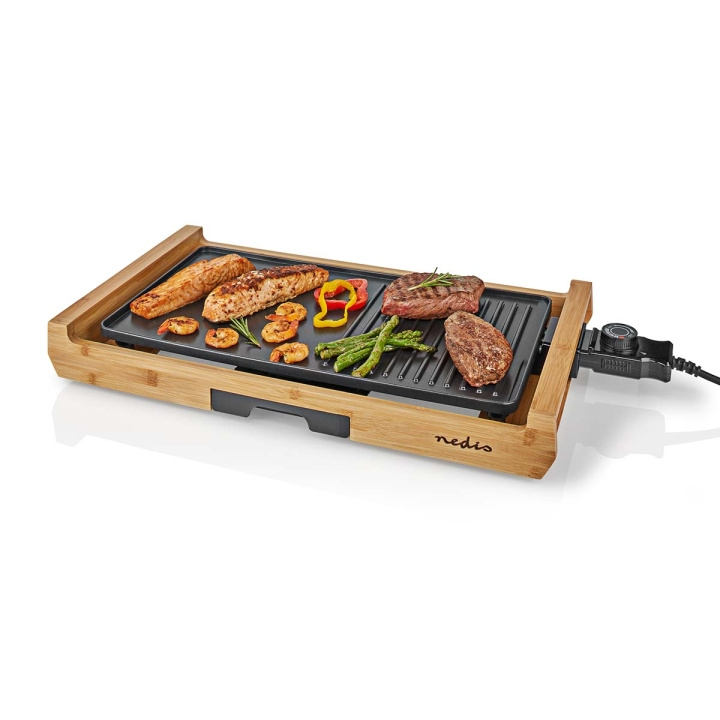 Nedis Teppanyaki Table Grill | Bakeflat (l x b): 43 x 23 cm | Antall personer: 6 Personer | Non-stick belegg | 4 Varmeinnstillinger i gruppen HJEM, HUS OG HAGE / Husholdningsapparater / Benkkomfyrer og kokeplater hos TP E-commerce Nordic AB (C08138)